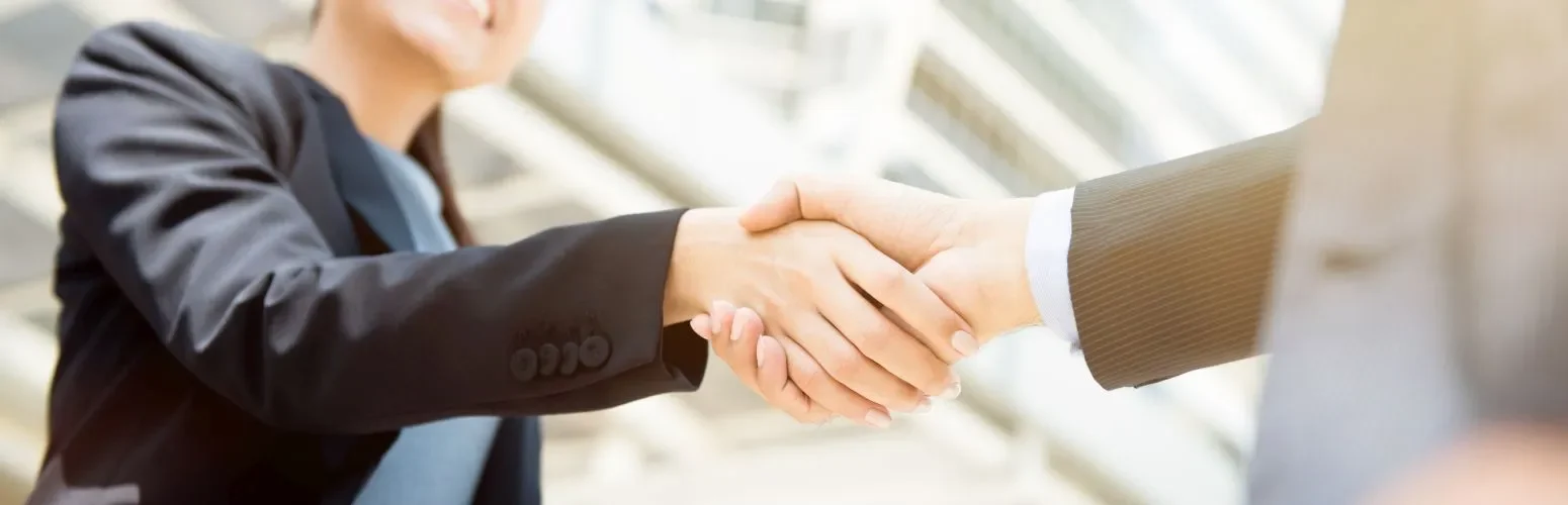 Business partners shake hands